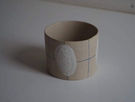 mok met geometrisch patroon